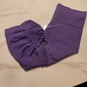 Purple Lululemon Capri workout pants.